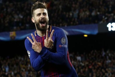 Barcelona's Gerard Pique celebrates after scoring the third goal of his team during a Champions League quarter-final, first leg soccer match between FC Barcelona and Roma at the Camp Nou stadium in Barcelona, Spain, Wednesday, April 4, 2018.(AP Photo/ Manu Fernandez)