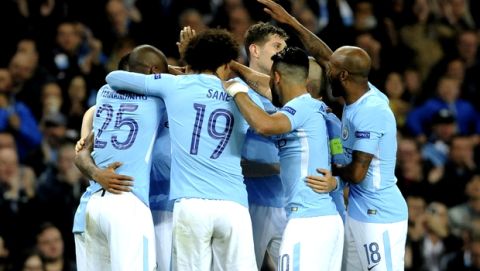 Manchester City's Kevin De Bruyne, is mobbed by teammates after scoring the opening goal of the game during the Champions League Group F soccer match between Manchester City and Shakhtar Donetsk at Etihad stadium, Manchester, England, Tuesday, Sept. 26, 2017. (AP Photo/Rui Vieira)