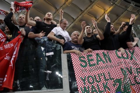 Liverpool fans celebrate behind a banner in English and Italian in support of Liverpool fan Sean Cox at the end of the Champions League semifinal second leg soccer match between Roma and Liverpool at the Olympic Stadium in Rome, Wednesday, May 2, 2018. Cox has been in an induced coma since being attacked before the first leg match in Liverpool. (AP Photo/Alessandra Tarantino)