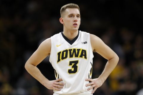 Iowa guard Jordan Bohannon stands on the court during the first half of an NCAA college basketball game against Minnesota, Tuesday, Jan. 30, 2018, in Iowa City, Iowa. (AP Photo/Charlie Neibergall)