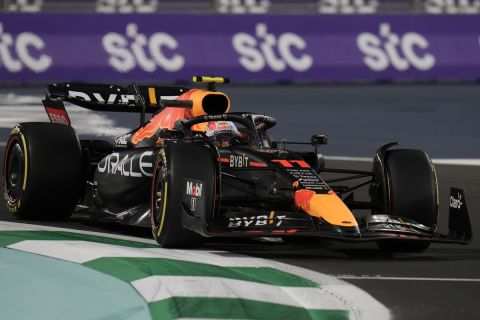 Red Bull driver Sergio Perez of Mexico steers his car during the second free practice for the Formula One Grand Prix at the Jiddah corniche circuit in Jiddah, Saudi Arabia, Friday, March 25, 2022. (AP Photo/Hassan Ammar)