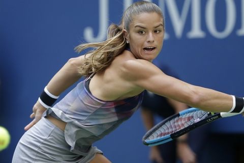 Maria Sakkari, of Greece, returns a shot from Venus Williams, of the United States, during the third round of the U.S. Open tennis tournament, Friday, Sept. 1, 2017, in New York. (AP Photo/Seth Wenig)