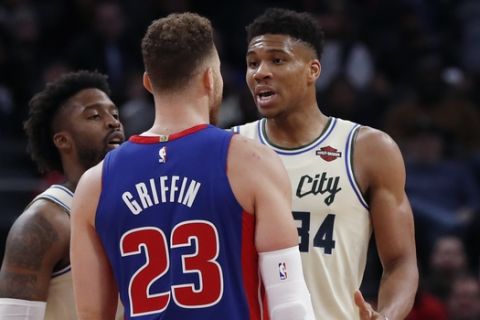 Detroit Pistons forward Blake Griffin (23) and Milwaukee Bucks forward Giannis Antetokounmpo (34) exchange words after a foul on the floor during the first half of an NBA basketball game, Wednesday, Dec. 4, 2019, in Detroit. (AP Photo/Carlos Osorio)