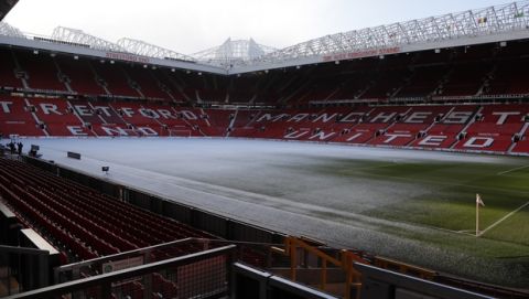 Snow on the pitch ahead of the English FA Cup quarterfinal soccer match between Manchester United and Brighton, at the Old Trafford stadium in Manchester, England, Saturday, March 17, 2018. (AP Photo/Frank Augstein)