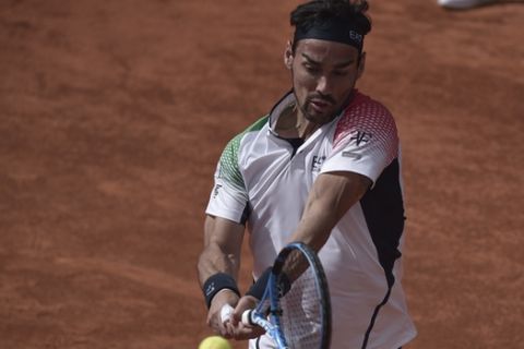 Italy's Fabio Fognini returns a ball to South Korea's Lee Duck-hee during their Davis Cup tennis match in Cagliari, Italy, Friday, March 6, 2020.  (Alessandro Tocco/LaPresse via AP)