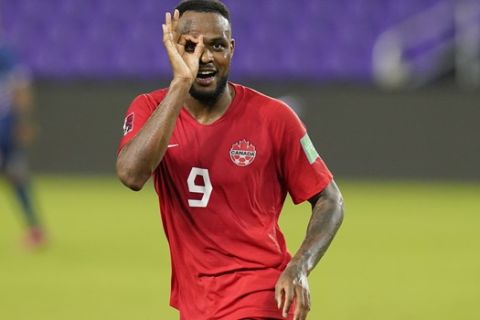 Canada forward Cyle Larin (9) gestures after scoring his third goal against Bermuda during the second half of a World Cup 2022 Group B qualifying soccer match, Thursday, March 25, 2021, in Orlando, Fla. (AP Photo/John Raoux)