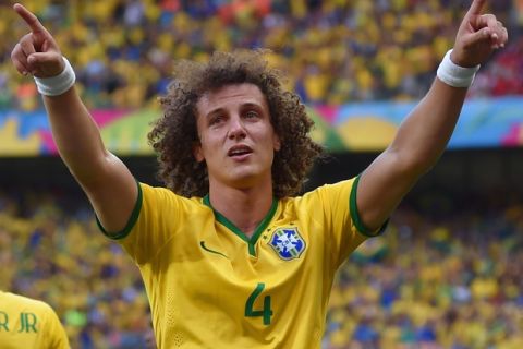BELO HORIZONTE, BRAZIL - JUNE 28:  David Luiz of Brazil celebrates scoring his team's first goal during the 2014 FIFA World Cup Brazil round of 16 match between Brazil and Chile at Estadio Mineirao on June 28, 2014 in Belo Horizonte, Brazil.  (Photo by Buda Mendes/Getty Images)