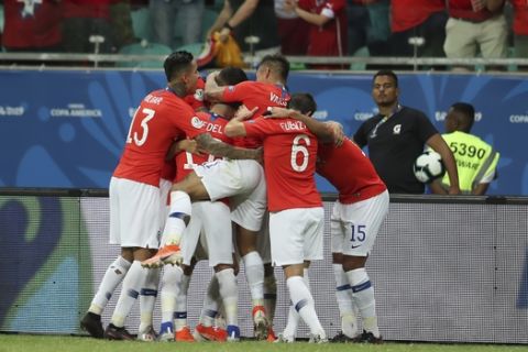 Chile's players celebrate their side's 2nd goal scored by teammate Alexis Sanchez during a Copa America Group C soccer match against Ecuador at the Arena Fonte Nova in Salvador , Brazil, Friday, June 21, 2019. (AP Photo/Natacha Pisarenko)