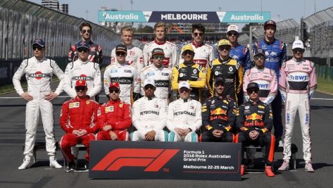 Drivers pose for a photograph on the track ahead of the first race of the season at the Australian Formula One Grand Prix in Melbourne, Sunday, March 25, 2018. (AP Photo/Asanka Brendon Ratnayake)