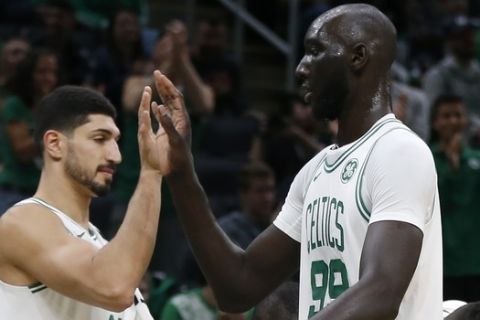 Boston Celtics' Gordon Hayward, second from left, Enes Kanter (11) and Tacko Fall (99) during the second half of a preseason NBA basketball game against the Charlotte Hornets in Boston, Sunday, Oct. 6, 2019. (AP Photo/Michael Dwyer)