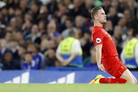 Liverpool's Jordan Henderson celebrates after scoring his side's second goal during the English Premier League soccer match between Chelsea and Liverpool at Stamford Bridge stadium in London, Friday, Sept. 16, 2016. (AP Photo/Frank Augstein)