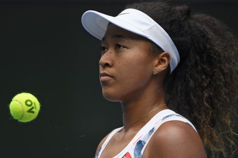 Japan's Naomi Osaka waits to serve to China's Zheng Saisai during their second round singles match at the Australian Open tennis championship in Melbourne, Australia, Wednesday, Jan. 22, 2020. (AP Photo/Andy Brownbill)