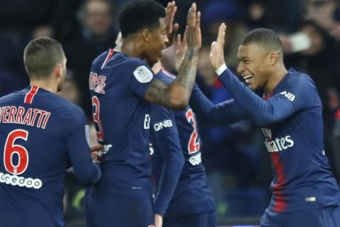 PSG's Kylian Mbappe celebrates with his teammates after scoring his side's fifth goal during the French League One soccer match between Paris Saint Germain and Montpellier at the Parc des Princes stadium in Paris, France, Wednesday, Feb. 20, 2019. (AP Photo/Francois Mori)
