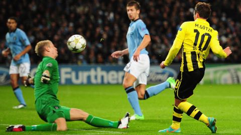 MANCHESTER, ENGLAND - OCTOBER 03:  Joe Hart of Manchester City blocks the shot of Mario Gotze of Borussia Dortmund during the UEFA Champions League Group D match between Manchester City and Borussia Dortmund at the Etihad Stadium on October 3, 2012 in Manchester, England. (Photo by Stu Forster/Getty Images)