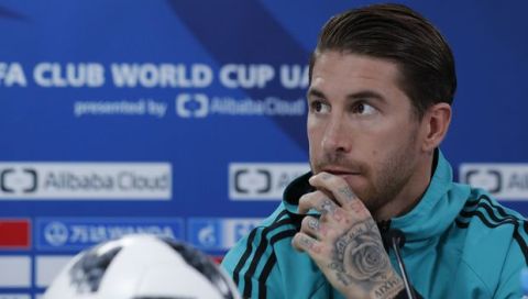 Real Madrid's captain Sergio Ramos speaks during a press conference at Zayed sport city in Abu Dhabi, United Arab Emirates, Friday, Dec. 15, 2017. Real Madrid will play against Gremio on Saturday in the Club World Cup final soccer match. (AP Photo/Hassan Ammar)