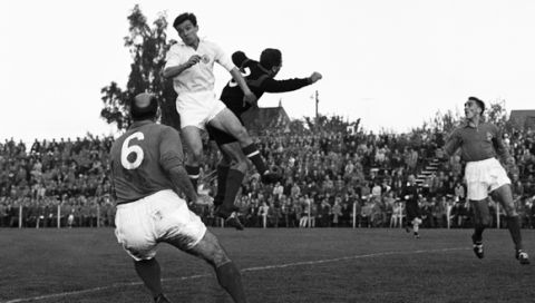 The situation before Yugoslavia's first goal in the first half with Yugoslavia's forward Todor (Toza) Veselinovic, center, and French goalie Francois Remetter, right, jumping for the ball, with French defender Roger Marche looking on, during the Football World Cup match at Vasteras, Sweden, on June 11, 1958. French player at far right unidentified. Yugoslavia won the match 3-2. (AP Photo)