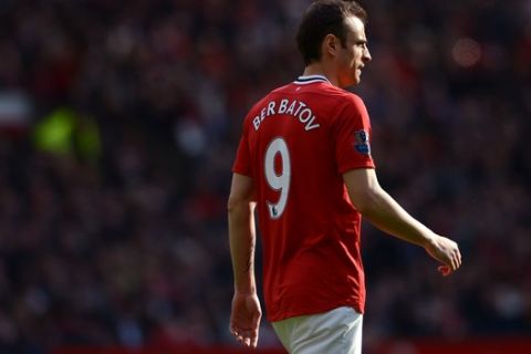 Manchester United's Dimitar Berbatov walks down the pitch during his team's English Premier League soccer match against Swansea at Old Trafford Stadium, Manchester, England, Sunday, May 6, 2012. (AP Photo/Jon Super)