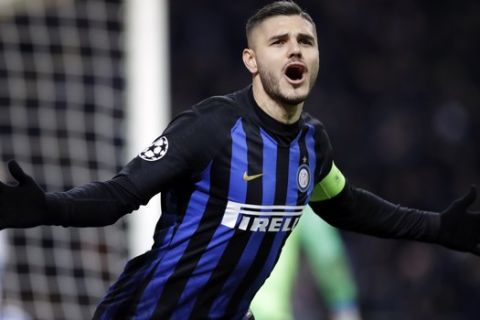 Inter Milan's Mauro Icardi celebrates after scoring his side's opening goal during the Champions League, Group B soccer match between Inter Milan and PSV Eindhoven, at the San Siro stadium in Milan, Italy, Tuesday, Dec. 11, 2018. (AP Photo/Luca Bruno)