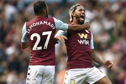 Aston Villa's Douglas Luiz, right celebrates his side's first goal of the game with Ahmed Elmohamady, during the English Premier League soccer match between Aston Villa and Bournemouth, at Villa Park, in Birmingham, England, Saturday, Aug. 17, 2019. (Tim Goode/PA via AP)
