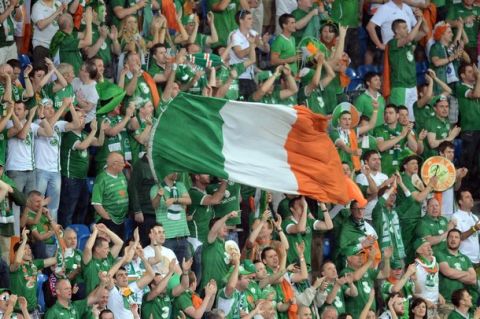 (FILES) - This picture taken on June 10, 2012 at the Municipal Stadium in Poznan shows Irish fans cheering before the Euro 2012 football championships match Ireland vs Croatia. European football's governing body is to give a special award to fans of the Republic of Ireland for their behaviour in Euro 2012 co-host Poland, UEFA's secretary-general, Gianni Infantino, said on June 30.   AFP PHOTO / DANIEL MIHAILESCU        (Photo credit should read DANIEL MIHAILESCU/AFP/GettyImages)