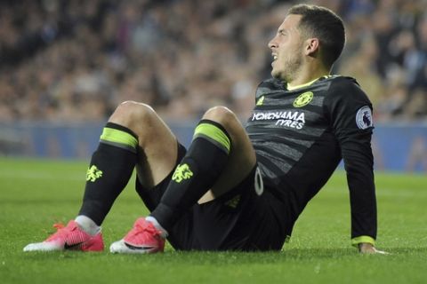 Chelsea's Eden Hazard sits on the grass after falling during the English Premier League soccer match between West Bromwich Albion and Chelsea, at the Hawthorns in West Bromwich, England, Friday, May 12, 2017. (AP Photo/Rui Vieira)