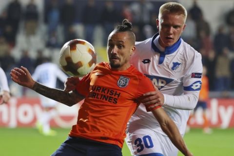 Basaksehir's Stefano Napoleoni, left, controls the ball in front of Hoffenheim's Phillipp Ochs, right, during the Europa League group C soccer match between Basaksehir and Hoffenheim, at the Fatih Terim stadium in Istanbul, Thursday, Nov. 2, 2017. (AP Photo)