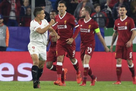 Sevilla's Wissam Ben Yedder, left, celebrates after scoring his side's first goal during a Champions League group E soccer match between Sevilla and Liverpool, at the Ramon Sanchez Pizjuan stadium in Seville, Spain, Tuesday, Nov. 21, 2017. (AP Photo/Miguel Morenatti)