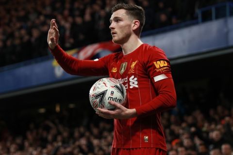 Liverpool's Andrew Robertson prepares to throw the ball during the English FA Cup fifth round soccer match between Chelsea and Liverpool at Stamford Bridge stadium in London Tuesday, March 3, 2020. (AP Photo/Ian Walton)