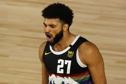 Jamal Murray of the Denver Nuggets reacts after a shot during the second half of Game 5 of an NBA basketball first-round playoff series, Tuesday, Aug. 25, 2020, in Lake Buena Vista, Fla. (Mike Ehrmann/Pool Photo via AP)