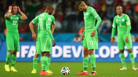 PORTO ALEGRE, BRAZIL - JUNE 30: Yacine Brahimi and Islam Slimani of Algeria wait to kick off in extra time during the 2014 FIFA World Cup Brazil Round of 16 match between Germany and Algeria at Estadio Beira-Rio on June 30, 2014 in Porto Alegre, Brazil.  (Photo by Julian Finney/Getty Images)
