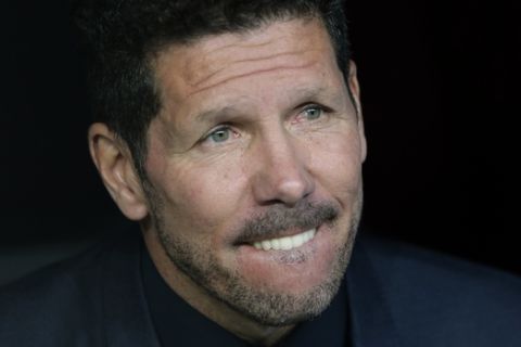 Atletico's head coach Diego Simeone sits on the bench during the Champions League semifinals first leg soccer match between Real Madrid and Atletico Madrid at Santiago Bernabeu stadium in Madrid, Spain, Tuesday May 2, 2017. (AP Photo/Daniel Ochoa de Olza)