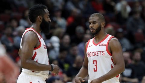 Houston Rockets guard Chris Paul, right, talks with guard James Harden during the second half of an NBA basketball game against the Chicago Bulls, Saturday, Nov. 3, 2018, in Chicago. The Rockets won 96-88. (AP Photo/Nam Y. Huh)