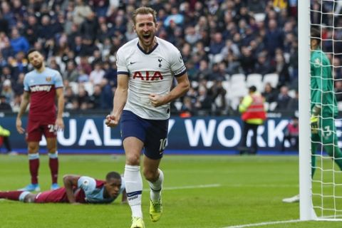 Tottenham's Harry Kane, center, celebrates after he scored his side's third goal during the English Premier League soccer match between West Ham and Tottenham, at London stadium, in London, Saturday, Nov. 23, 2019.(AP Photo/Frank Augstein)