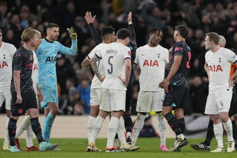 Tottenham players call for a foul after the opening goal by Manchester City's Nathan Ake during the English FA Cup fourth round soccer match between Tottenham Hotspur and Manchester City in London, Friday, Jan. 26, 2024. (AP Photo/Dave Shopland)