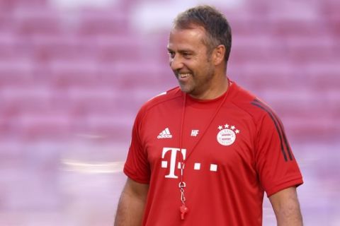 Bayern's coach Hans-Dieter Flick smiles during a training session at the Luz stadium in Lisbon, Saturday Aug. 22, 2020. Bayern Munich will play PSG in the Champions League final soccer match on Sunday. (David Ramos/Pool via AP)
