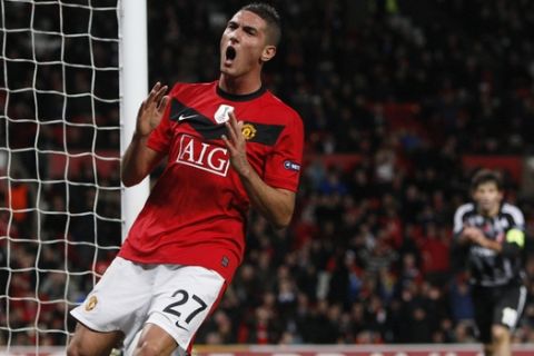 Manchester United's Federico Macheda, left, reacts after a missed opportunity against Besiktas during their Champions League group B soccer match at Old Trafford, Manchester, England, Wednesday Nov. 25, 2009. (AP Photo/Jon Super)