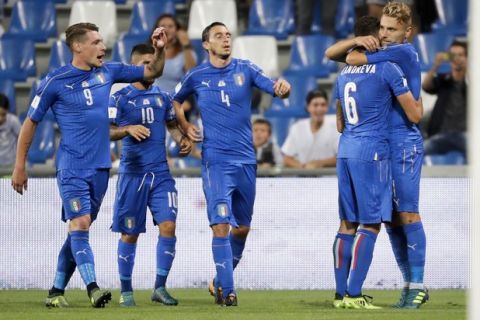 Italy's Ciro Immobile, right, celebrates with teammate Antonio Candreva after scoring during the World Cup Group G qualifying soccer match between Italy and Israel at the Mapei Stadium in Reggio Emilia, Italy, Tuesday, Sept. 5, 2017. (AP Photo/Luca Bruno)