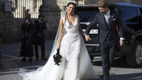 Real Madrid defender Sergio Ramos and model and presenter Pilar Rubio walk outside the cathedral after getting married during their weeding ceremony in Sevilla, Spain, Saturday, Jun 15, 2019. (AP Photo/Antonio Pizarro)