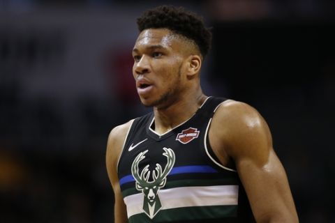 Milwaukee Bucks forward Giannis Antetokounmpo stands on the court in the first half of an NBA basketball game against the Charlotte Hornets in Charlotte, N.C., Sunday, March 1, 2020. Milwaukee won 93-85. (AP Photo/Nell Redmond)