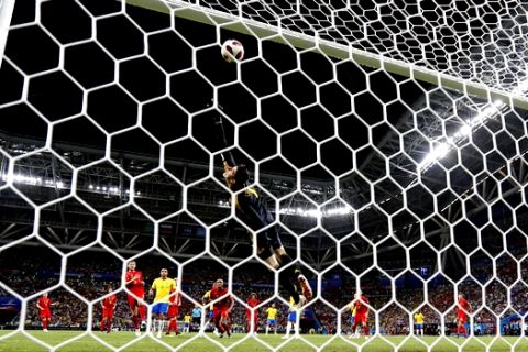Belgium goalkeeper Thibaut Courtois saves from Brazil's Neymar during the quarterfinal match between Brazil and Belgium at the 2018 soccer World Cup in the Kazan Arena, in Kazan, Russia, Friday, July 6, 2018. (AP Photo/Frank Augstein)