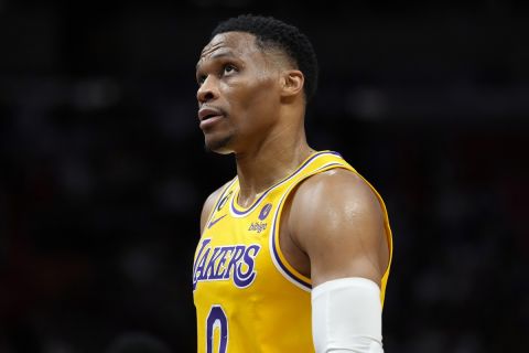 Los Angeles Lakers guard Russell Westbrook walks down the court during the first half of an NBA basketball game against the Miami Heat, Wednesday, Dec. 28, 2022, in Miami. (AP Photo/Lynne Sladky)