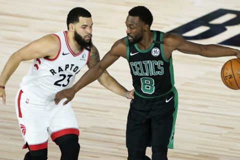 Boston Celtics' Kemba Walker (8) moves the ball against Toronto Raptors' Fred VanVleet (23) during the first half of an NBA basketball conference semifinal playoff game Sunday, Aug. 30, 2020, in Lake Buena Vista, Fla. (AP Photo/Ashley Landis)