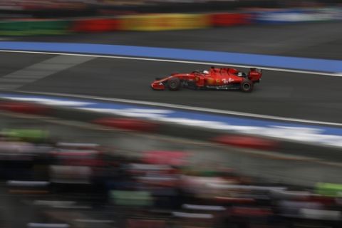 Ferrari driver Sebastian Vettel, of Germany, competes during the qualifying session for the Formula One Mexico Grand Prix auto race at the Hermanos Rodriguez racetrack in Mexico City, Saturday, Oct. 26, 2019. (AP Photo/Rebecca Blackwell)