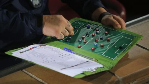 Atletico de Madrid's assistant coach German Burgos looks at a tactics board before the Group A Champions League soccer match between Atletico de Madrid and Juventus at the Vicente Calderon stadium in Madrid, Spain, Wednesday Oct. 1, 2014. (AP Photo/Andres Kudacki)