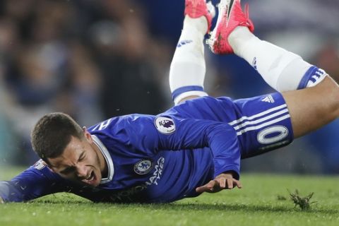 Chelsea's Eden Hazard falls after a tackle with Middlesbrough's Fabio Da Silva during the English Premier League soccer match between Chelsea and Middlesbrough at Stamford Bridge stadium in London, Monday, May 8, 2017. (AP Photo/Frank Augstein)