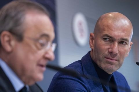 Zinedine Zidane speaks next to President of Real Madrid, Florentino Perez, during a press conference in Madrid, Spain, Thursday, May 31, 2018. Zinedine Zidane quit as Real Madrid coach on Thursday, less than a week after leading the team to its third straight Champions League title, saying the club needed a change in command. (AP Photo/Borja B. Hojas)