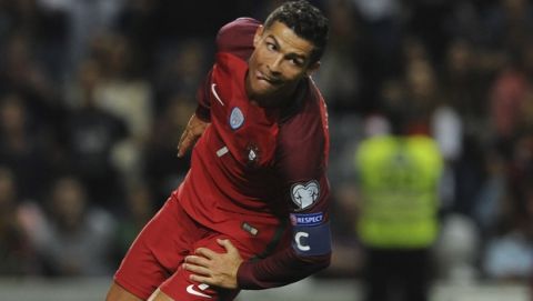 Portugal's Cristiano Ronaldo reacts after scoring his side's fourth goal during the World Cup Group B qualifying soccer match between Portugal and Faroe Islands at the Bessa Stadium in Porto, Portugal, Thursday Aug. 31, 2017. (AP Photo/Paulo Duarte)