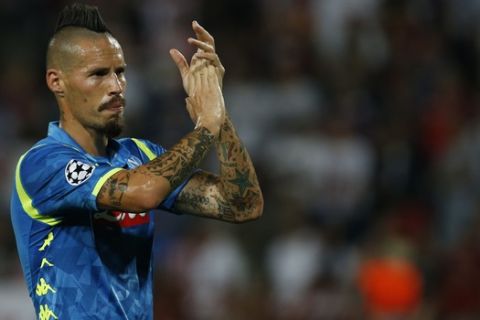 Napoli midfielder Marek Hamsik applauds supporters after the Champions League group C soccer match between Red Star and Napoli, in Belgrade, Serbia, Tuesday, Sept. 18, 2018. (AP Photo/Darko Vojinovic)
