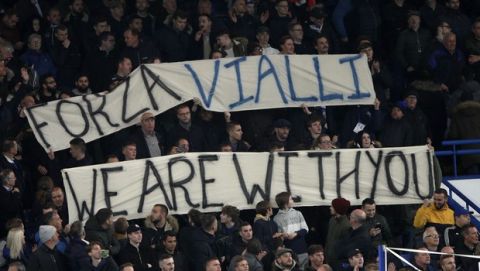 Chelsea fans hold a banner in support of former coach Gianluca Vialli who is fighting cancer before the English League Cup soccer match between Chelsea and Manchester United at Stamford Bridge in London, Wednesday, Oct. 30, 2019. (AP Photo/Ian Walton)