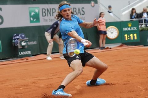 Greece's Stefanos Tsitsipas plays a shot against Germany's Maximilian Marterer during their first round match of the French Open tennis tournament at the Roland Garros stadium in Paris, Sunday, May 26, 2019. (AP Photo/Michel Euler )